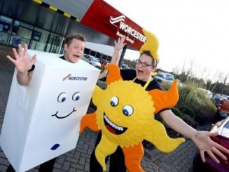 Bobby the Boiler and Solar Sam take to the stage at a local school